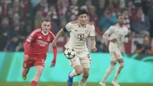 Bayern's Kim Min-jae (C) runs with the ball, followed by Benfica's Kerem Aktürkoğlu during the Champions League opening phase match, Munich, Germany, Nov. 6, 2024. (AP Photo)