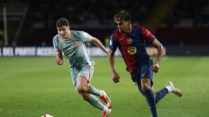 Atletico Madrid's Julian Alvarez (L) and Barcelona's Lamine Yamal fight for the ball during a Spanish Copa del Rey semifinal match, Barcelona, Spain, Feb. 25, 2025. (AP Photo)
