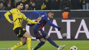 Barcelona's Raphinha scores the opening goal during the Champions League opening phase match against Borussia Dortmund at the Signal-Iduna Park, Dortmund, Germany, Dec. 11, 2024. (AP Photo)