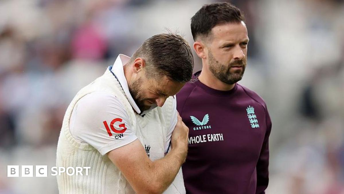 Chris Woakes walking off the field grimacing in pain after dislocating his shoulder on day one of the fifth Test against India in July.