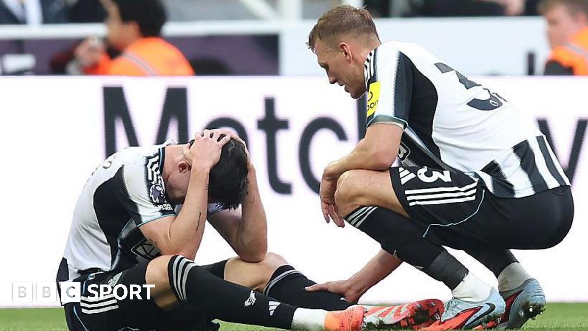 Dan Burn consoles Tino Livramento after he suffered a knee injury in Newcastle United