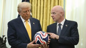 FIFA President Gianni Infantino (R) presents President Donald Trump with the new FIFA Club World Cup official ball in the Oval Office of the White House, Washington, U.S., March 7, 2025. (AP Photo)