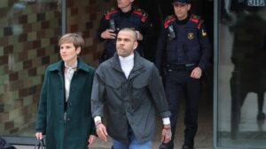 Convicted rapist and former Brazil international football player Dani Alves (R) leaves on provisional release, flanked by his lawyer Ines Guardiola, at Brians 2 prison in San Esteban Sasroviras, Barcelona, Spain, March 25, 2024. (AFP Photo)