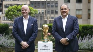 FIFA President Gianni Infantino (L) and Vice President, CONCACAF President Victor Montagliani stand with the FIFA World Cup trophy,  New York, U.S., June 16, 2022. (AP Photo)