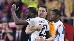 Real Madrid defender Antonio Rudiger is restrained as he shouts at the referee during the Copa del Rey final against Barcelona, Seville, Spain, April 26, 2025. (AA Photo)
