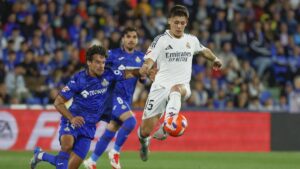 Real Madrid's Arda Güler (R) in action against Getafe's Juan Bernat (L) during the Spanish La Liga match, Madrid, Spain, April 13, 2025. (EPA Photo)