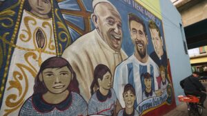 The late Pope Francis is depicted on a mural alongside football player Lionel Messi at the Carlos Mugica neighborhood, Buenos Aires, Argentina, April 21, 2025. (AP Photo)