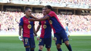 Barcelona's Raphinha (L) celebrates with Lamine Yamal (C) and Dani Olmo after scoring during the La Liga match against Celta Vigo at Estadi Olimpic Lluis Companys, Barcelona, Spain, April 19, 2025. (Reuters Photo)