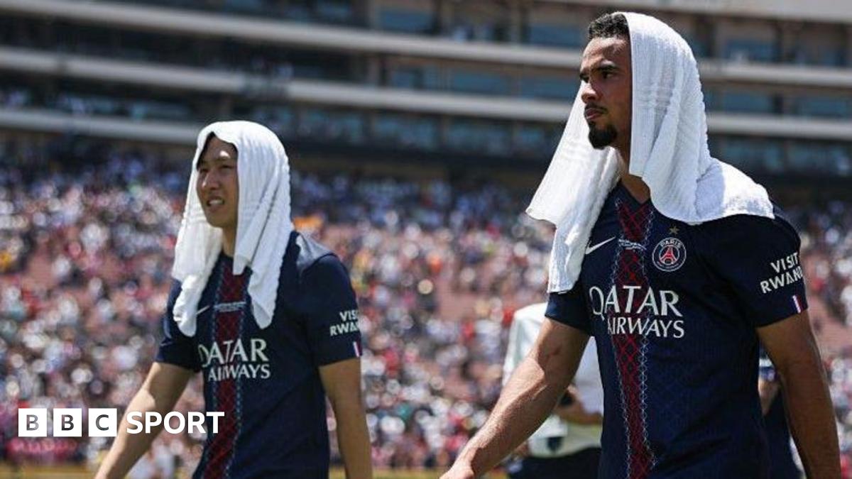 PSG duo Lee Kang-in and Warren Zaire-Emery with a towel on their head to try and cool them down after the Club World Cup encounter with Atletico Madrid