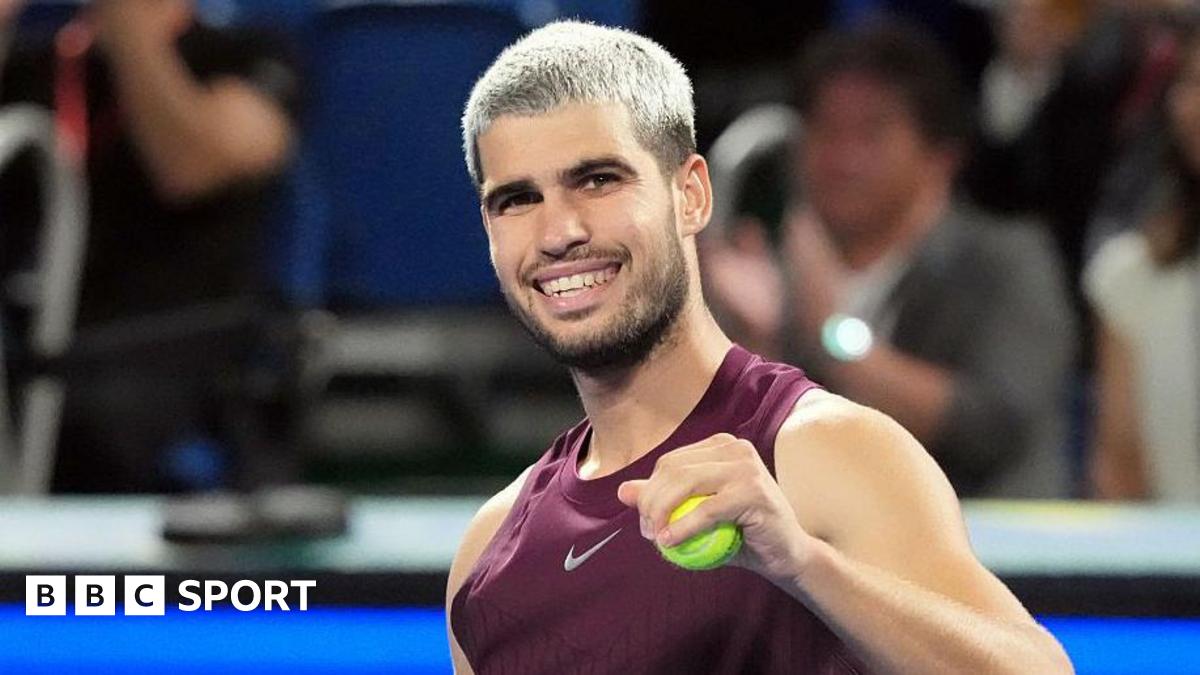 Carlos Alcaraz has a tennis ball in his hand