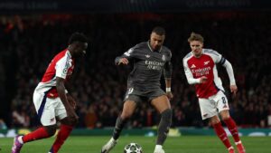 Real Madrid's Kylian Mbappe (C) in action with Arsenal's Martin Odegaard (R) and Bukayo Saka during the UEFA Champions League Quarter final first leg football match at the Emirates Stadium, London, U.K., April 8, 2025. (AFP Photo)