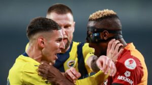 Fenerbahçe's Mert Müldür (L) confronts Galatasaray's Victor Osimhen during the Süper Lig match at Ülker Şükrü Saracoğlu Stadium, Istanbul, Türkiye, April 2, 2025. (Getty Images Photo)