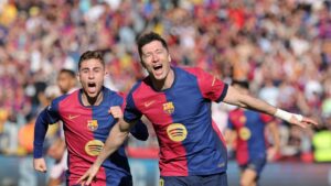 Barcelona's Robert Lewandowski (R) celebrates scoring his team's second goal during the La Liga match against Girona at the Estadi Olimpic Lluis Companys, Barcelona, Spain, March 30, 2025. (AFP Photo)