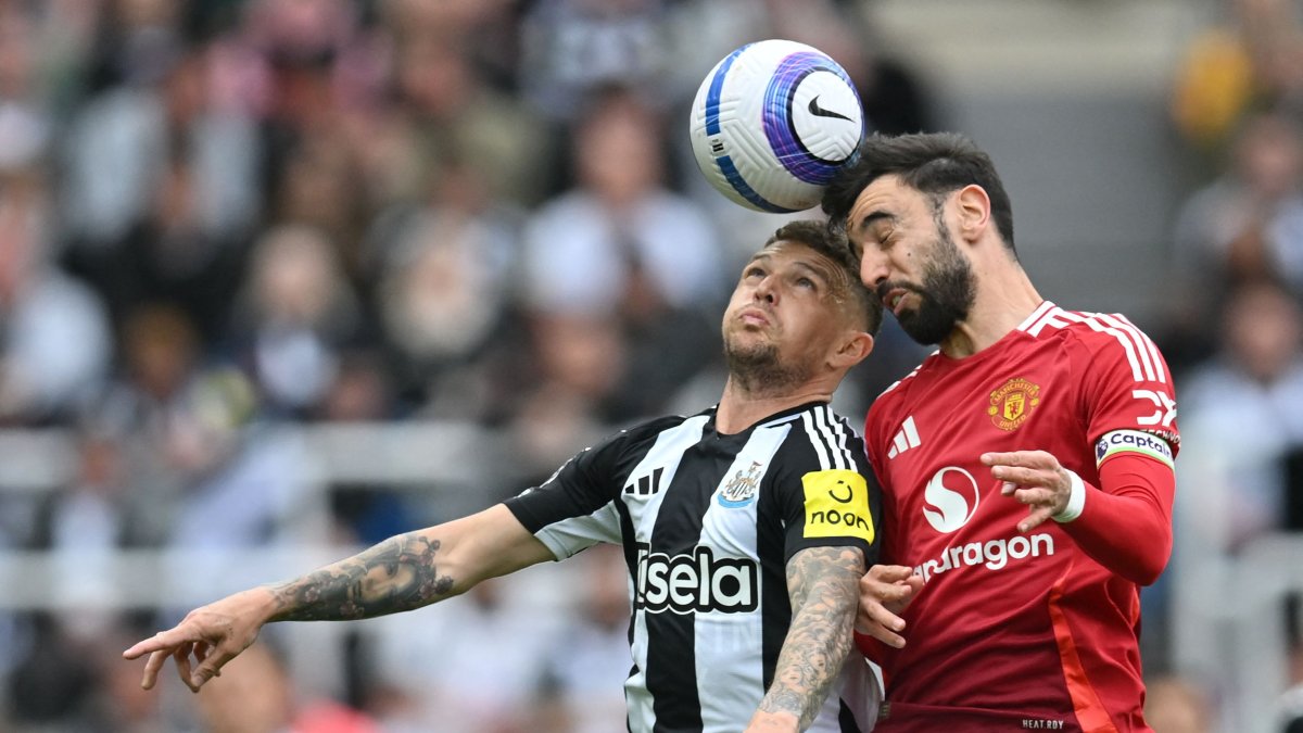 Newcastle United's Kieran Trippier (L) vies with Manchester United's Bruno Fernandes during the English Premier League match at St James' Park, Newcastle-upon-Tyne, U.K., April 13, 2025. (AFP Photo)