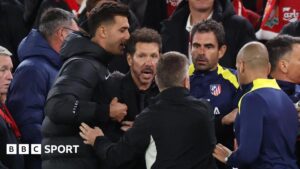 Diego Simeone is held back before being sent off in his side